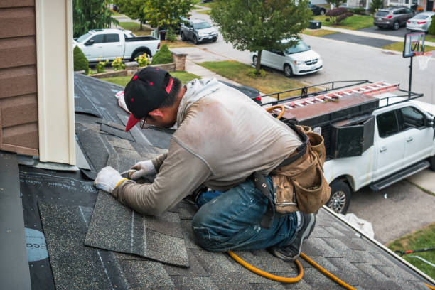 Professional Roof Replacement technician working in Dumont, IA